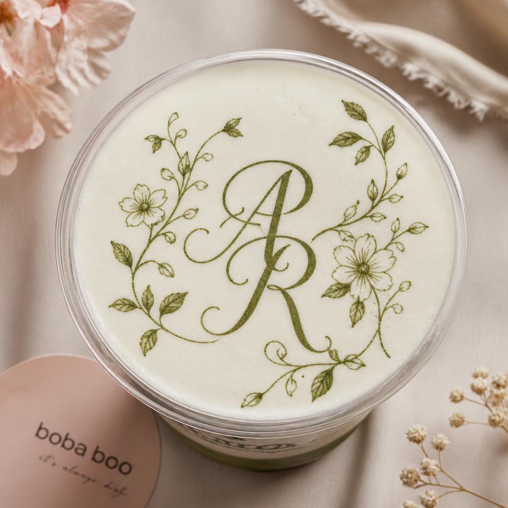 Latte with an elegant wedding monogram printed on the foam